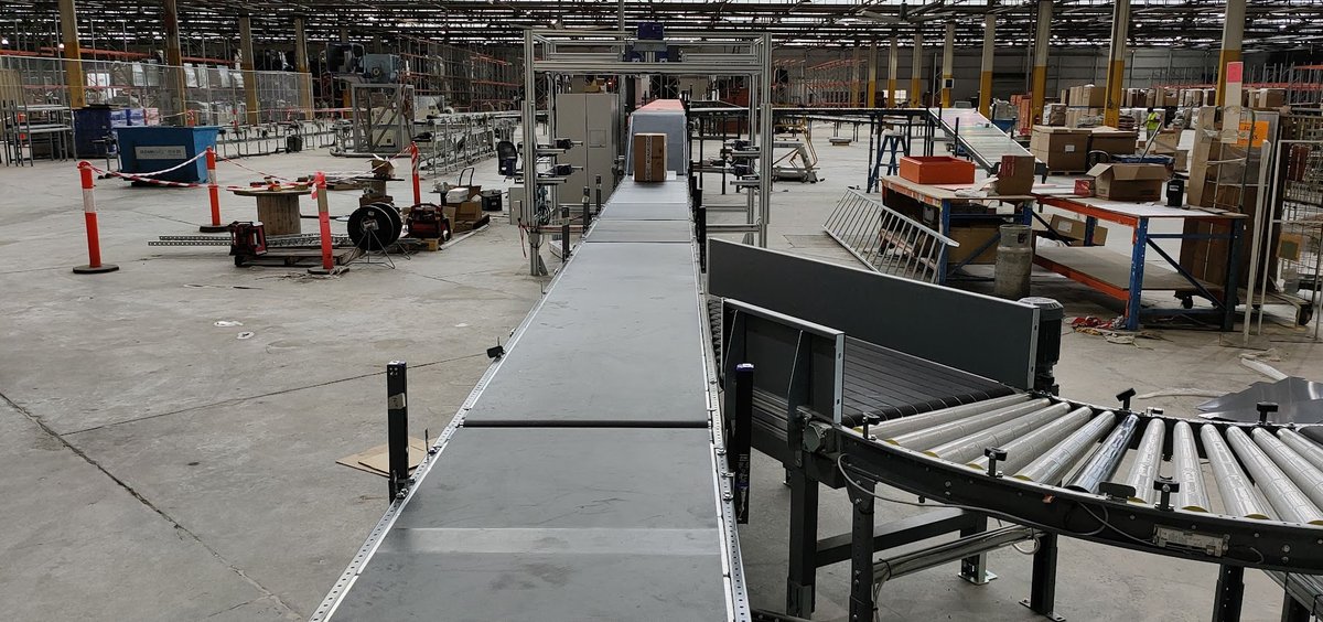Sortation conveyor and scanner gantry mid-commissioning