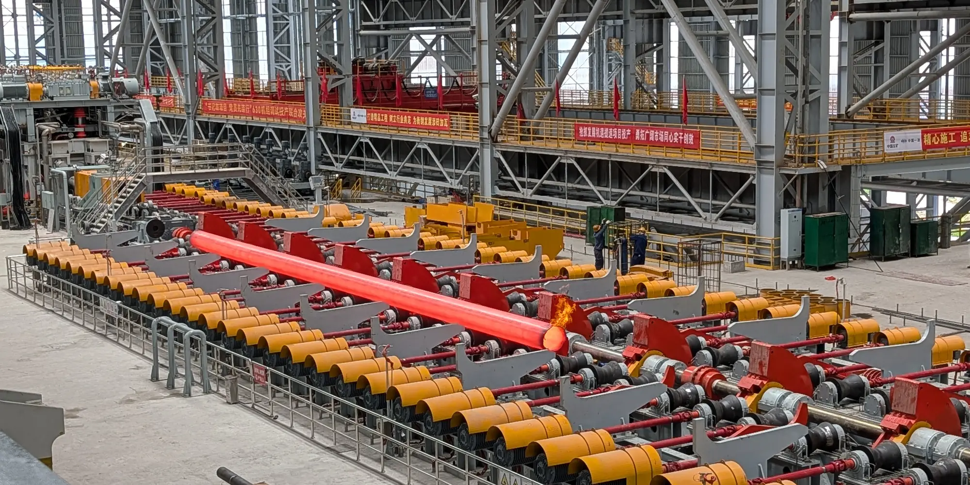 Red-hot seamless steel tube on the cooling bed at a tube mill in Hengyang, China